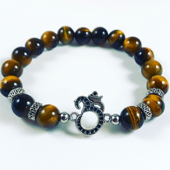 Silverskylight Other - Genuine golden tiger eye gemstone om sign bracelet